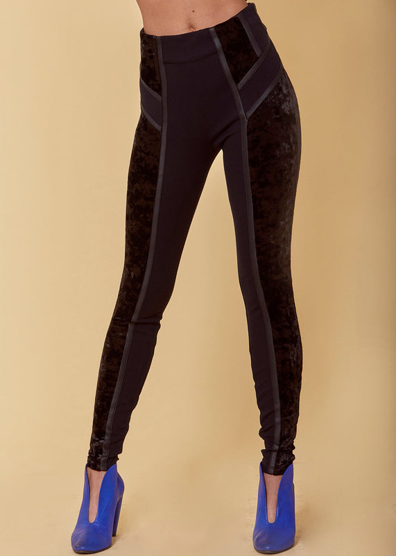 Crushed velvet legging style pant with mid-rise, pull on styling, Cuba piping detail and ponte self-fabric paneled side accents in black.